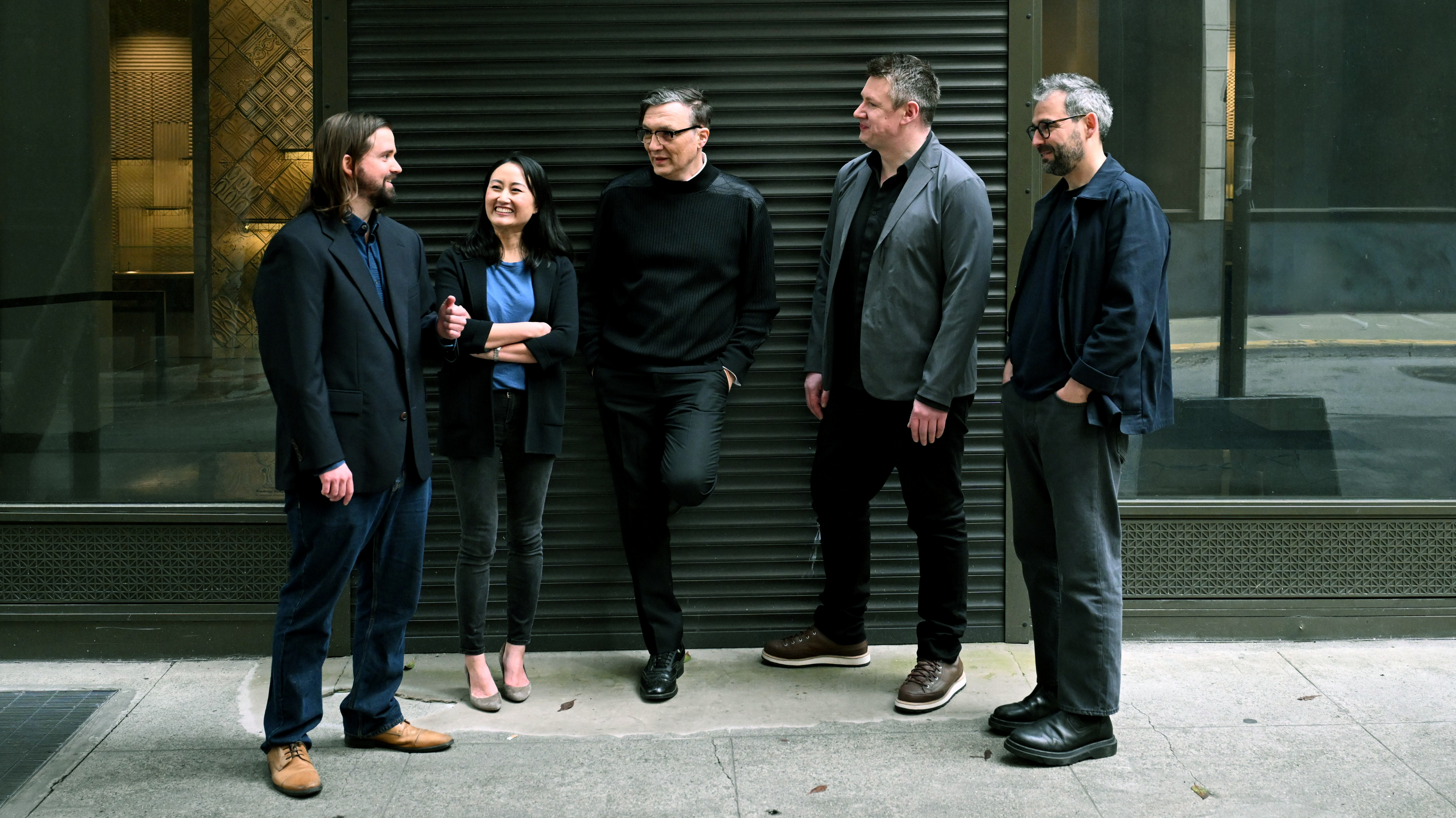 The five members of the Archetype AI founding team in conversation outside a building